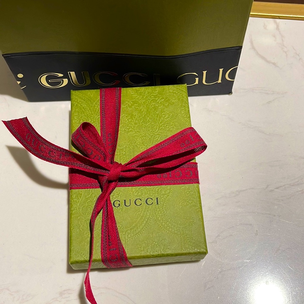 Gucci dust bag ( small ) wallet size .